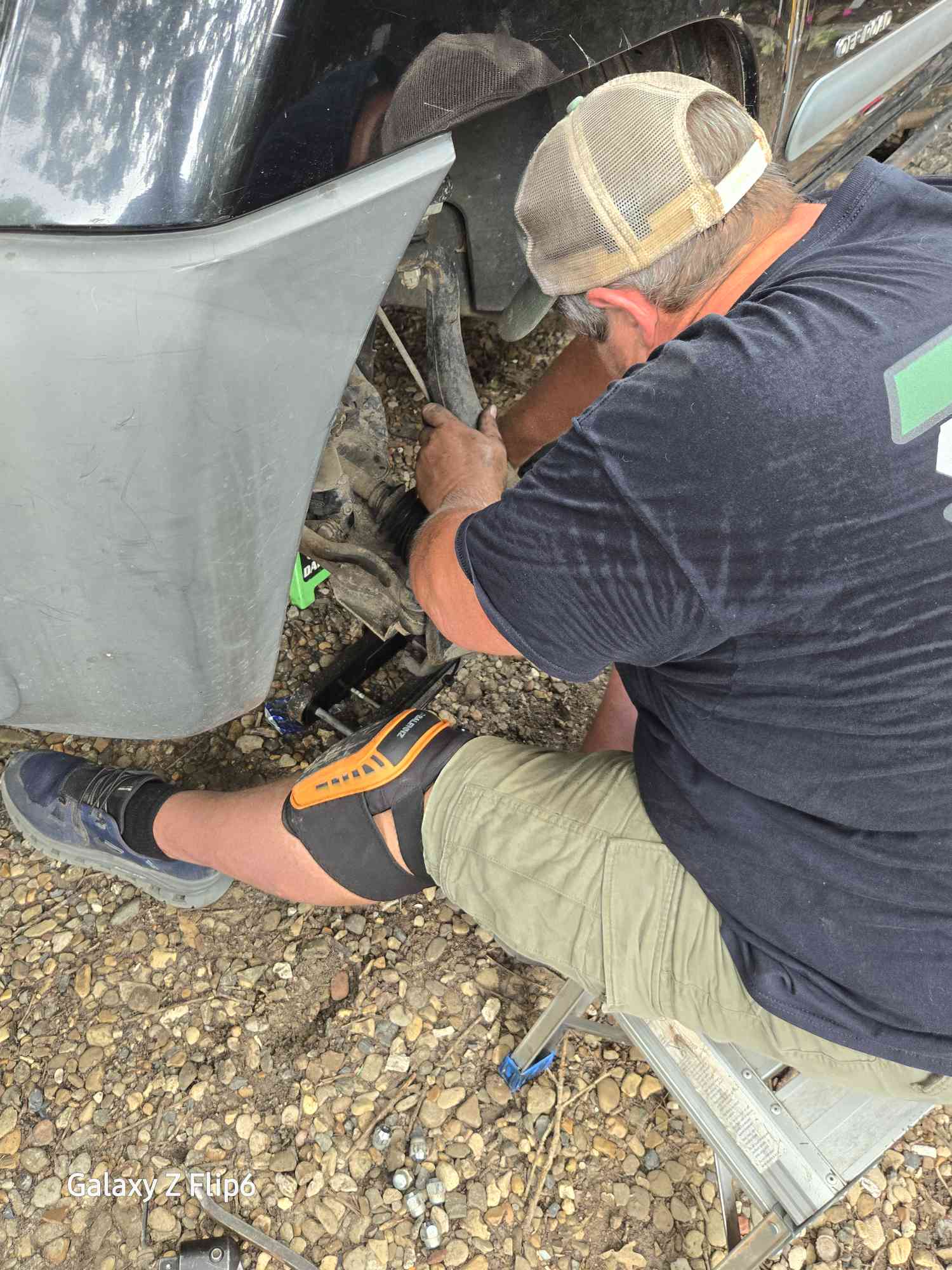 Mobile Mechanic Working on Car